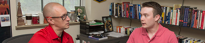 Student and professor in a office room